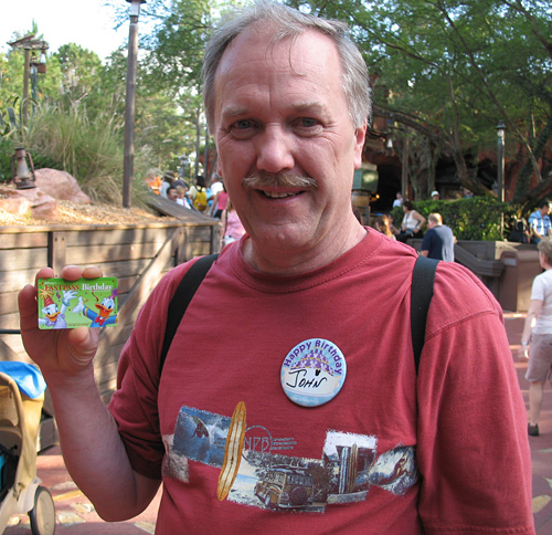 Dad shows off his Birthday Fastpass Card