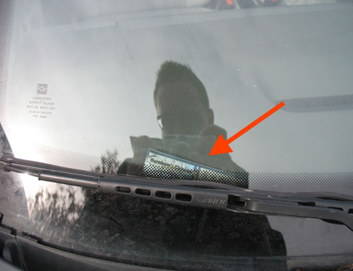 February 16: Sticker has fallen off window onto dashboard