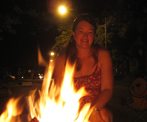 Amy makes s'mores in the street